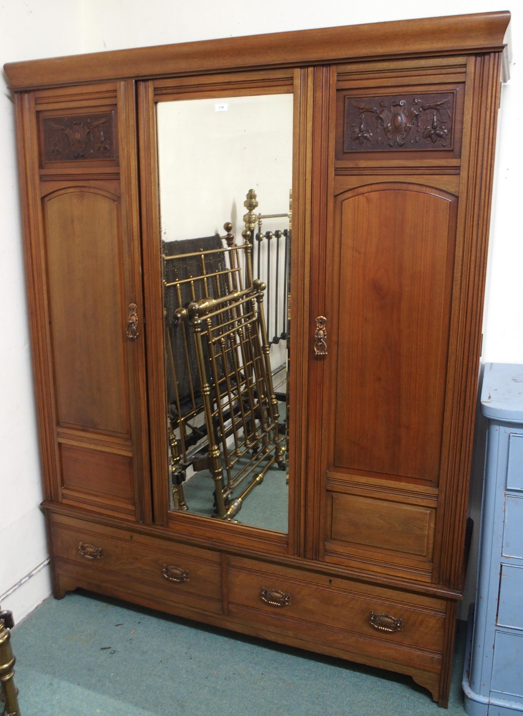 A Victorian mahogany wardrobe with central mirror flanked by doors over two drawers, 201cm high x