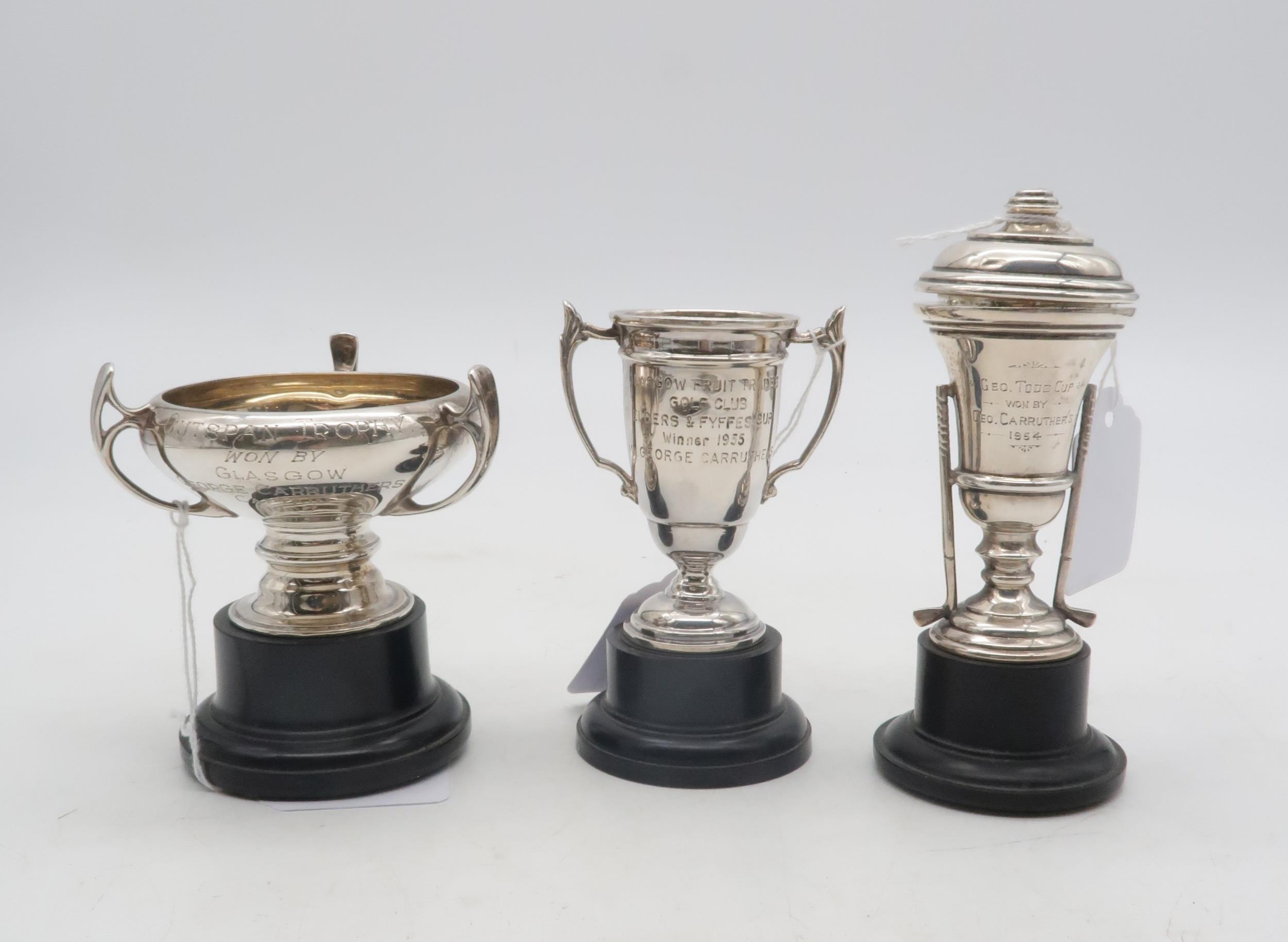 Three silver presentation trophy cups, one by Adie Brothers Ltd, another golfing themed example,