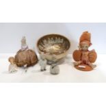 A Satsuma bowl decorated with figures, a porcelain baby pin cushion, half doll pin cushion,