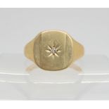 A 9ct signet ring with a star set diamond accent, size T1/2, weight 6gms Condition Report: