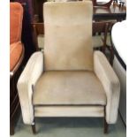 A circa 1960 continental style reclining armchair with beige velour upholstery, 98cm high x 69cm