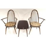 A pair of mid 20th century elm and beech Ercol rail back dining carvers and a elm and beech Ercol