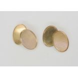 A pair of 9ct gold cufflinks with both plain and engine turned faces, weight 8.4gms Condition