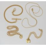 Two 9ct gold curb chain bracelets with heart shaped clasps, a 9ct gold snake chain, length 46cm, and
