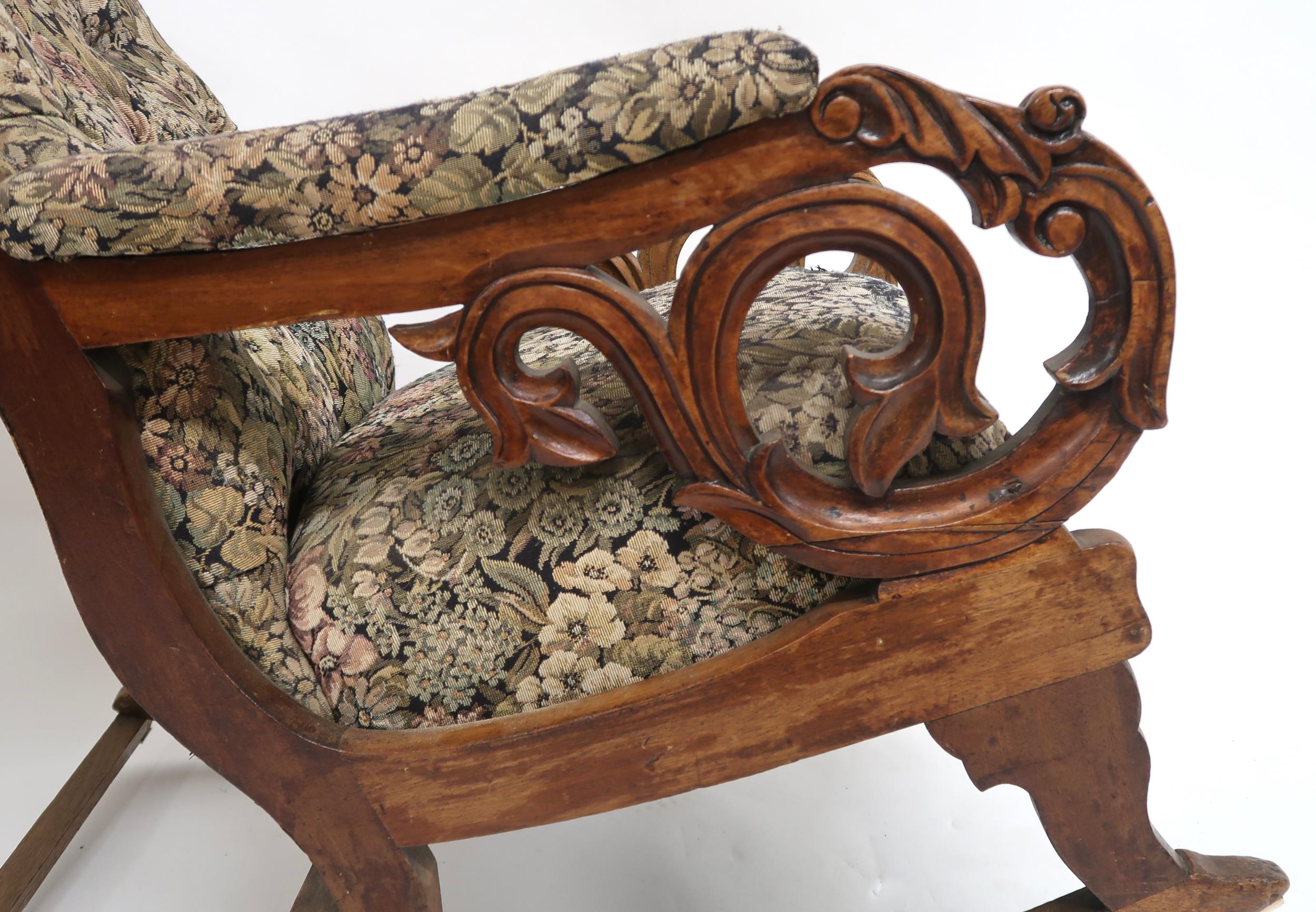 A Victorian walnut framed rocking chair with floral button back upholstery, carved scrolled arms - Image 5 of 6