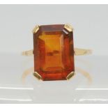 A yellow metal ring set with a cognac colour citrine, size M, weight 4.1gms Condition Report: