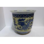 A large Chinese blue and yellow plant pot decorated with dragons Condition Report:Available upon