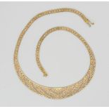 A 9ct three colour gold collar necklace, at widest point 1.5cm, length 41cm, weight 19.7gms