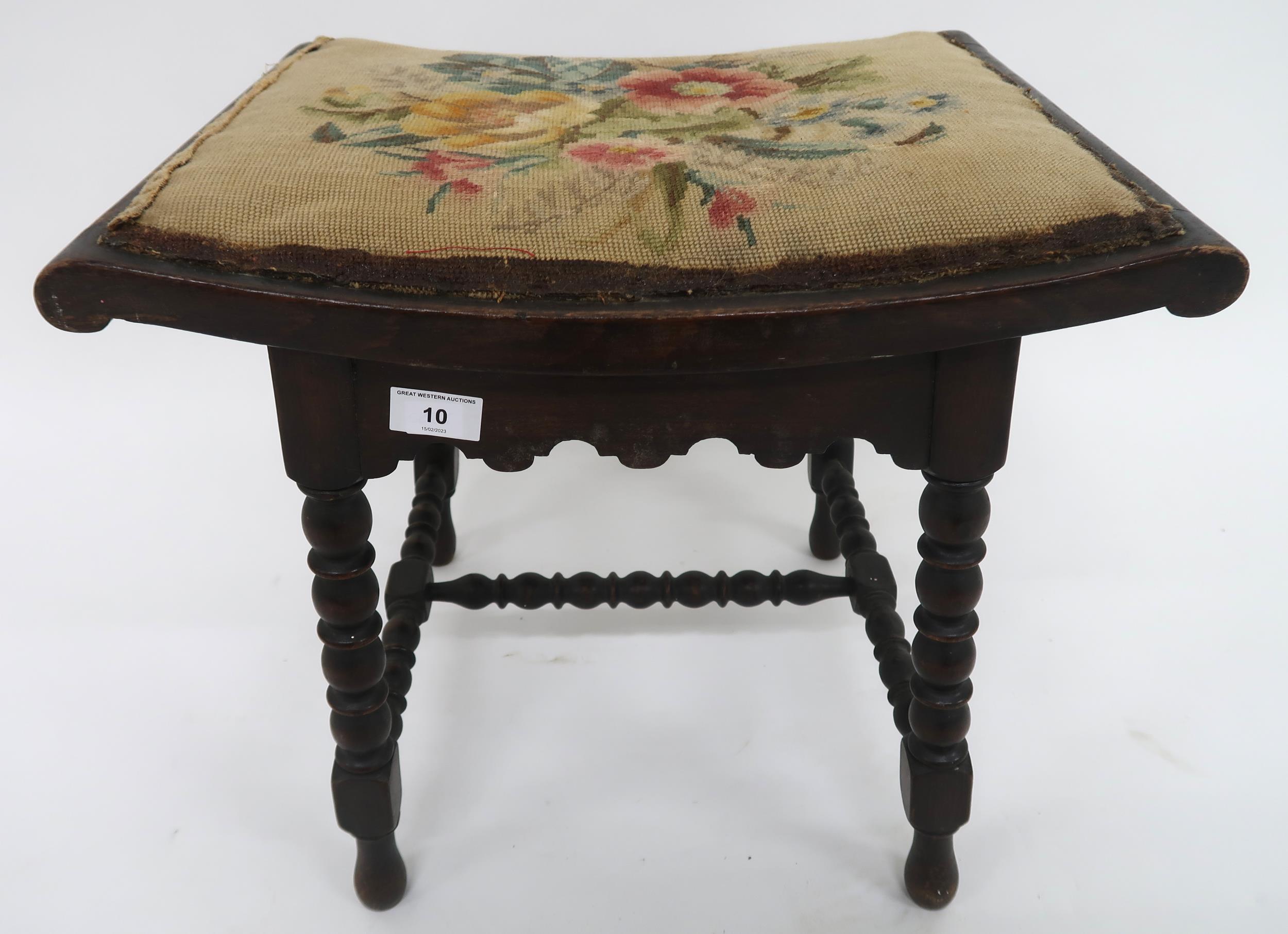 A Victorian mahogany framed stool with tapestry upholstered seat on turned bobbin stretchers and
