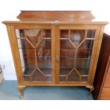 An early 20th century mahogany glazed display cabinet on cabriole feet, 116cm high x 107cm wide x