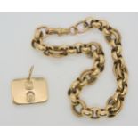 A 9ct gold fancy link bracelet and a yellow metal ingot pendant bearing the hallmark stamp for