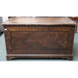 A Victorian pitch pine blanket chest with hinged top concealing internal cavity with candle drawer
