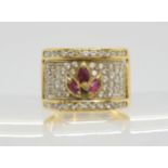 An Italian made 18ct gold clear gem and ruby wide band ring, size R1/2, weight 10.6gms Condition