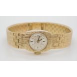 A 9ct gold Jaquet Droz retro wristwatch with all over texture, length 17cm, weight including