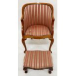 A 20th century mahogany framed tub chair on cabriole supports and accompanying footstool both