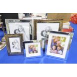 A collection of silver plated / chrome rectangular and square photo frames, of varying sizes,