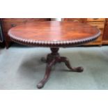 A Victorian rosewood oval tilt topped breakfast table on tripod base, 74cm high x 129cm long x 105cm