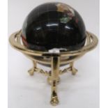 A 20th century gemstone inset table top globe, 48cm high x 41cm diameter Condition Report: