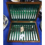 A cased mahogany canteen of EPNS bladed and mother of pearl handled fruit knives and forks, by