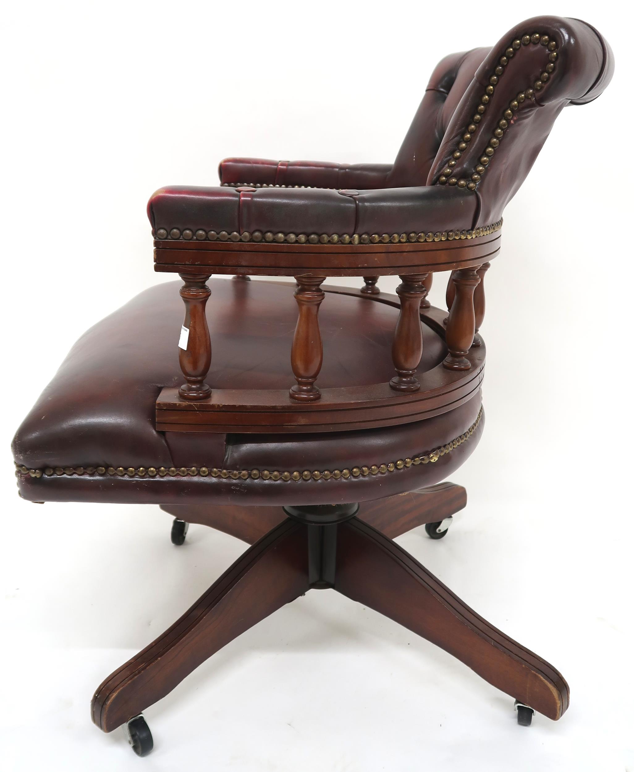 A 20th century oxblood leather upholstered revolving "captain's" desk chair, 85cm high x 63cm wide x - Image 5 of 7