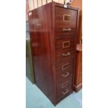 A 20th century steel bodied four drawer filing cabinet painted with faux wood grain, 131cm high x