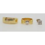 A bright yellow metal diamond solitaire ladies pinkie ring, size F, set with a 0.10ct brilliant cut,