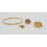 A collection of 9ct items to include a bangle, faux coin ring, size M, a child's signet ring, size