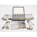 A collection of silver including a set of Danish silver gilt and blue enamel coffee spoons, the