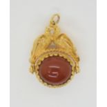 A 9ct gold love birds fob pendant set with carnelian, length approx 3cm, weight 10gms Condition