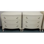 A pair of 20th century continental style white painted chests of three drawers, 74cm high x 78cm