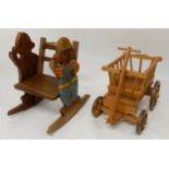 A contemporary Moulin Roty child's pull cart and a contemporary child's rocking chair with carved