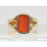An 18ct gold ring set with a carnelian, finger size approx T, weight 7.1gms Condition Report: