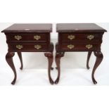 A pair of 20th century mahogany two drawer bedside tables on cabriole supports, 68cm high x 52cm