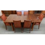 A mid 20th century Afromosia teak extending dining table, 75cm high x 176cm long extended (leaf is