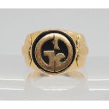 A continental bright yellow metal and onyx signet ring, size J, weight 11gms Condition Report: