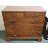 A 19th century mahogany two over three chest of drawers with brass drawer pulls on bracket feet,