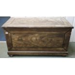 A Victorian pitch pine blanket chest with hinged top concealing internal cavity and candle drawers