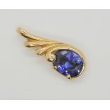 A tanzanite pendant in bright yellow metal, length 2.5cm, weight 2.4gms Condition Report:Available