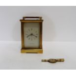A Mappin and Webb brass and glass carriage clock, with key Condition Report:winds, needs a clean