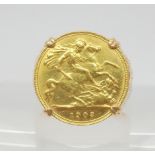 A 1903 gold half sovereign in a 9ct gold ring mount, finger size T1/2, weight 10.3gms Condition