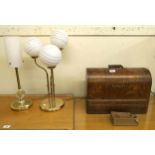 A lot of two 20th century brass based table lamps and an oak cased Singer sewing machine (3)