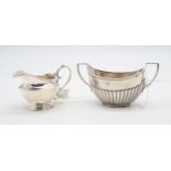 A Victorian silver sugar bowl, the body fluted, by William Hutton & Sons, London 1894, and a