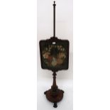 A Victorian rosewood and tapestry pole-screen with adjustable floral tapestry panel on turned