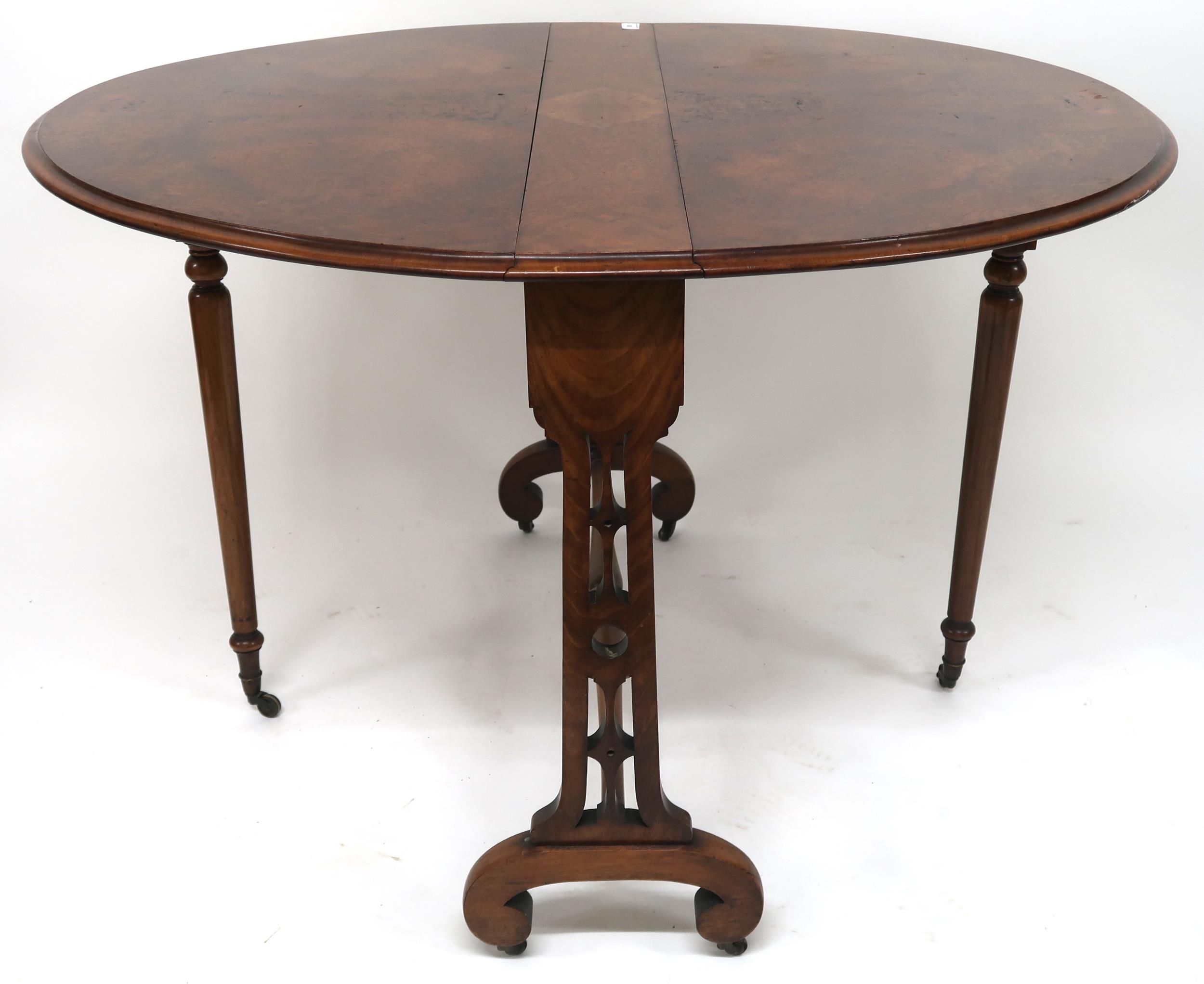 A Victorian burr walnut John Taylor & Son Edinburgh drop end oval Sutherland style table, 73cm
