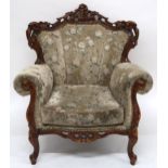 A 20th century mahogany framed floral upholstered armchair on cabriole supports, 100cm high x 89cm