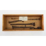 A cased display of iron nails "from Roman Legionary Fortress at Inchtuthil, Perthshire, Scotland,