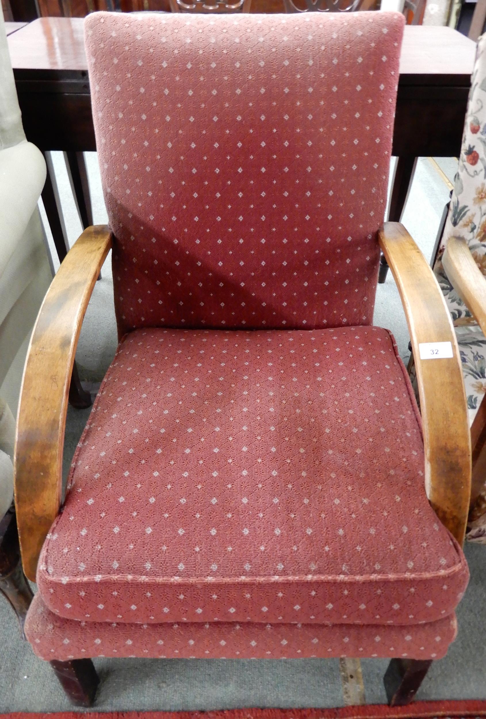 An early 20th century art deco style armchair with bowed arms over square supports, 87cm high x 62cm