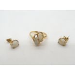A 10ct gold double marquis shaped white opal ring, size N, weight 2.5gms, together with a pair of