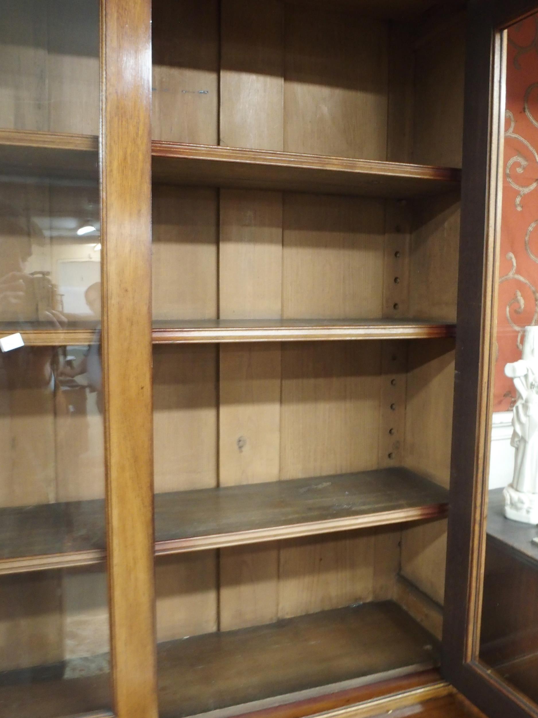 A Victorian mahogany bookcase on base with moulded cornice over pair of glazed doors over drawers - Image 5 of 5