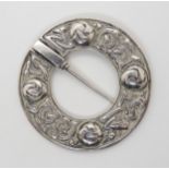 A silver Alexander Ritchie mythical beasts, circular brooch, with Glasgow hallmarks for 1925, with